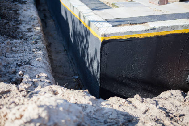 Professional Basement Waterproofing technician working in Carey, OH